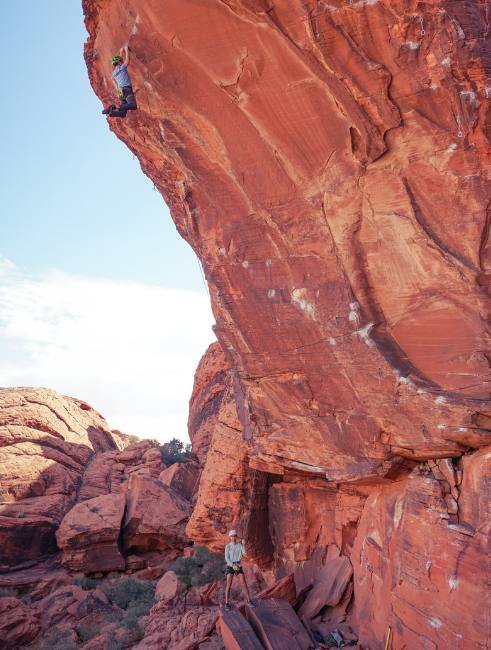 Gilbert sport climbing on a red rock