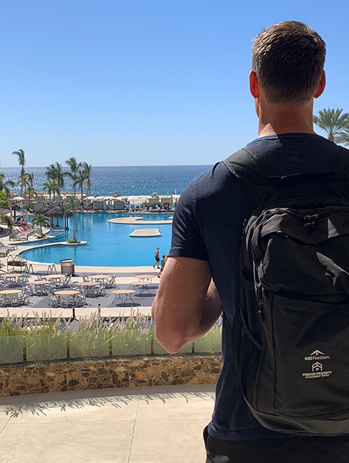 man in cabo wearing rei backpack